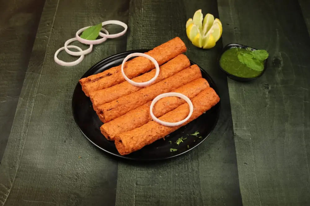 Five chicken tandoori seekh kababs with mint chutney, lemon and onion